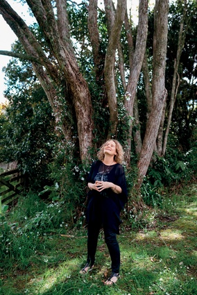 The artist in her element, under a tree in the garden of her studio. 