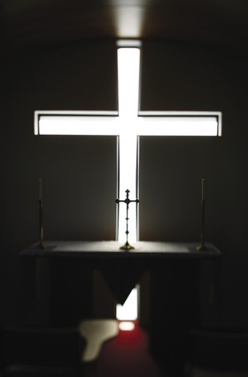 A recessed cross draws light and serenity into the chapel.