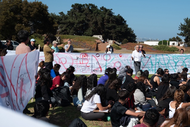 A poem written by the student body at La Ciudad Abierta is read aloud during a poetic act to mark the beginning of the school year. 