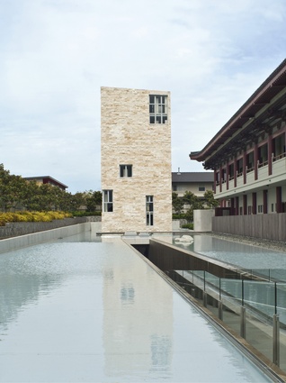 A reflective pool surrounds the pagoda. 