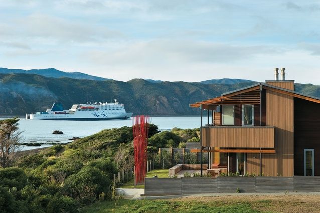 A ferry heads out to Cook Strait past the Seatoun house designed by Novak & Middleton. 