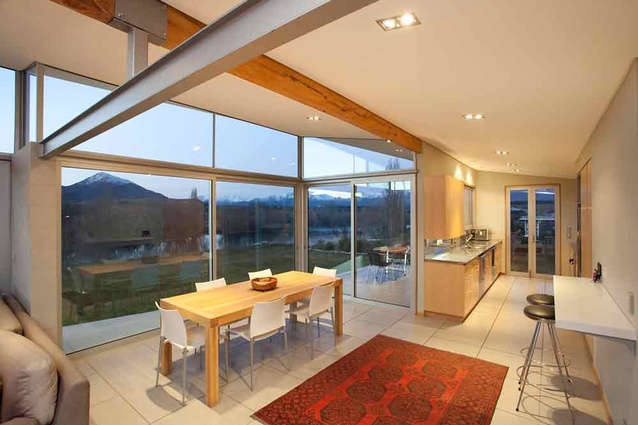 The kitchen and dining space with the Clutha river beyond. 