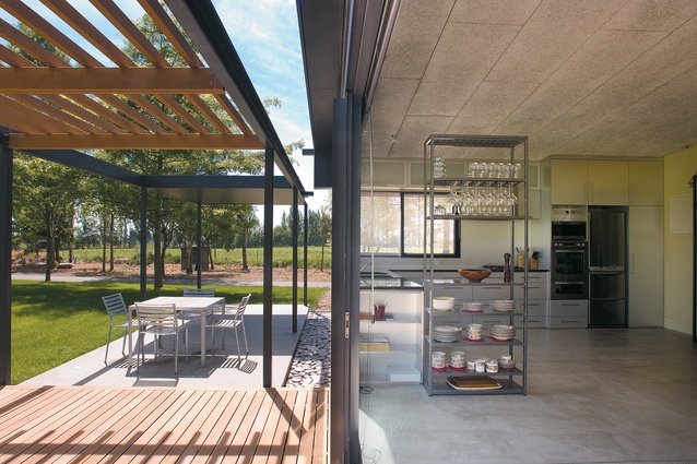 The terrace and kitchen, with its heat-retaining concrete floor. 