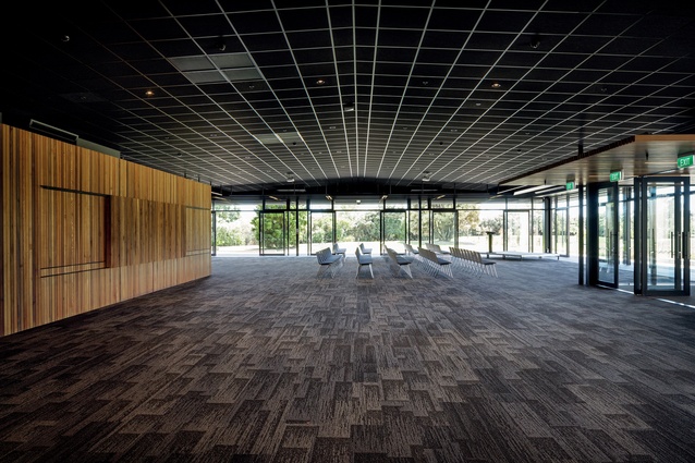 The ante-room or gathering space inside the entrance features timber-clad facilities for food, toilets and ticketing.