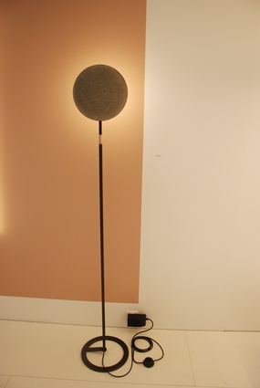 Designed by Achim Manz, this lamp features a disc of frosted glass, creating a soft light, and a backing of fine concrete.