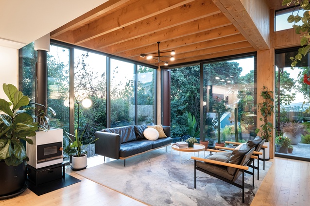 Full-height glazing to the front of the main living space creates a connection with the outdoors and provides ample natural light.