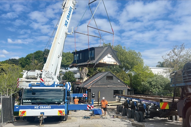 The top floor of a contemporary house is removed for relocation.