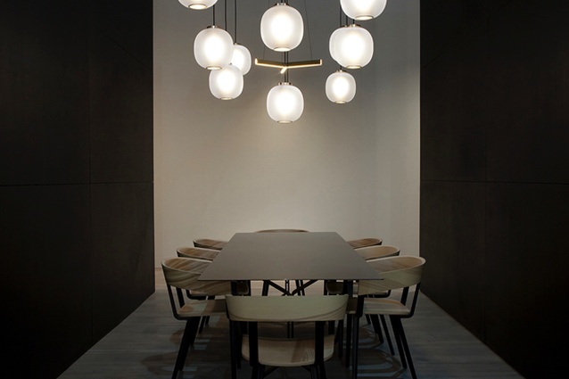 Resident's stand at Euroluce featuring Bloom pendants, Tri pendant, Odin chairs and Scholar table.