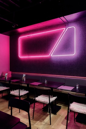 Lowbrow’s neon wall lighting was designed by Walker Mitchell, who created the entire design for Lowbrow, and fabricated by Pro Sign Services. 
