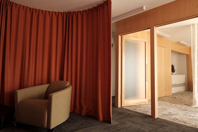 Heavy felt curtains are used in the meeting space to create a sense of enclosure and privacy.