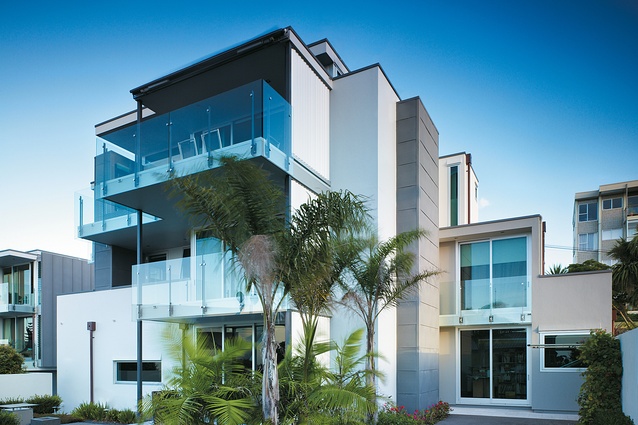 The three-storey rear elevation of the townhouses looks across St Heliers to the Hauraki Gulf and Rangitoto. 