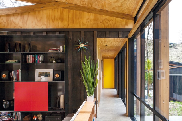 Splashes of colour, natural timber and exterior cladding in the interior of the Easterbrook House.
