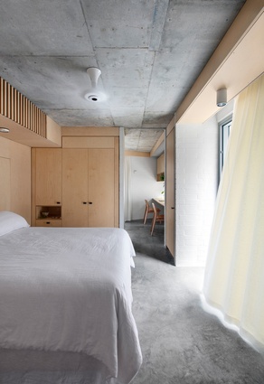 The main bedroom opens to a leafy rear courtyard, a happy by-product of the home’s parallelogram-shaped plan.