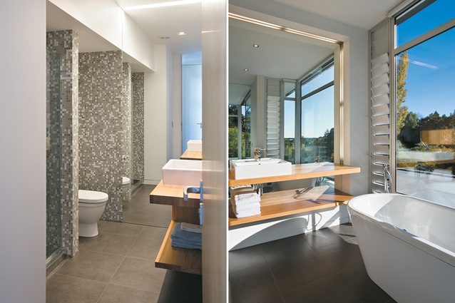 The ground floor bathroom features a full-height mirror, which serves to make the space seem larger; the ensuite has expansive views across the river.