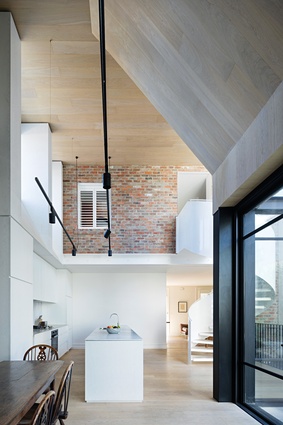 The architects favoured the drama of a double-height living space over additional floor space on the upper level.