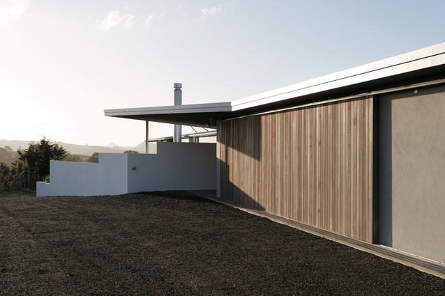 The house forms a barrier between the driveway and the views.  