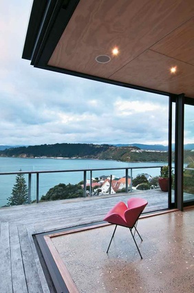 Sliding doors open the corner of the living area to the views of the harbour. 