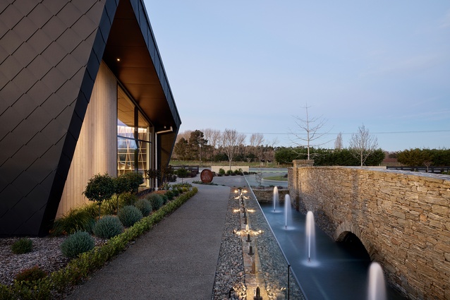 The café looks out onto established landscaping, which includes a large man-made pond, arched stone bridge and fountained-lined walkway.