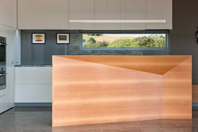 The kitchen with its sculptural bench. 