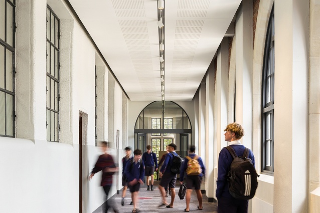 Corridors, originally open cloisters, link the linear sequence of classrooms and function as efficient, light-filled circulation spaces.
