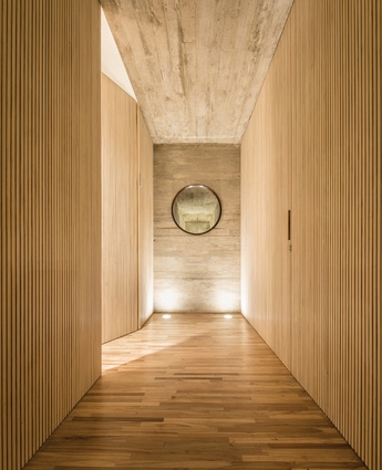 The interior palette is made up of wood and shuttered concrete.  