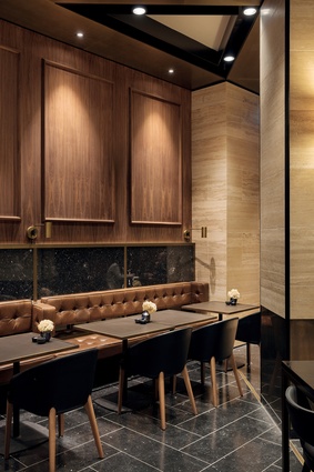 Wall and floor tiles are Pedre Dark Travertine. Columns are clad in dark bronze anodised aluminium. Furniture is sourced from Thonet and Stylecraft. 