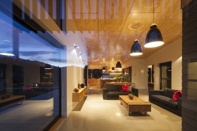 The raked ceiling and open plan layout impart a feeling of spaciousness within the living area.  