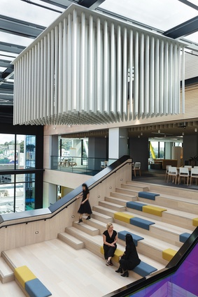 In the atrium, acoustically designed, suspended panels resemble large wind chimes. 
