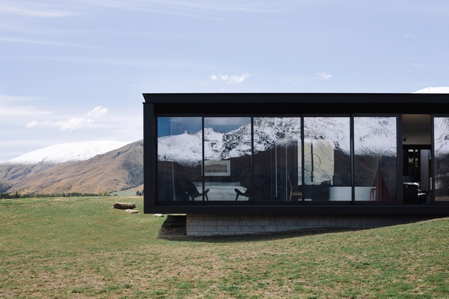 Alpine Terrace House: Part of the extensively glazed house sits on a floating ledge.