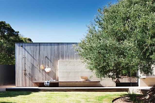 Pale rammed earth is the primary building element, complemented by timbers.