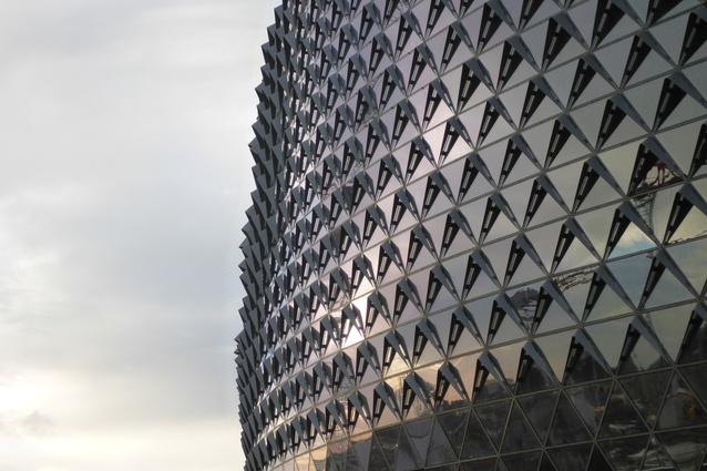 Inspired by the skin of a pine cone, the building’s triangulated dia-grid facade responds to its environment like a living organism.