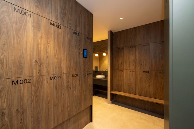 The use of wood is echoed in the bathrooms, this time in a deeper walnut shade.