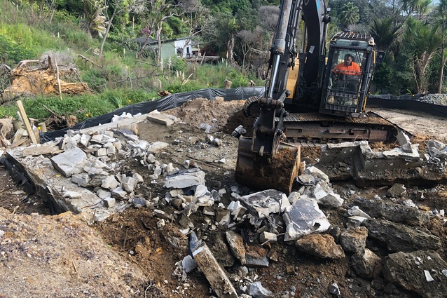 Deconstruction crews cut slabs into pieces but handling requires heavy equipment, making containment difficult, particularly in the latter stages of the process.