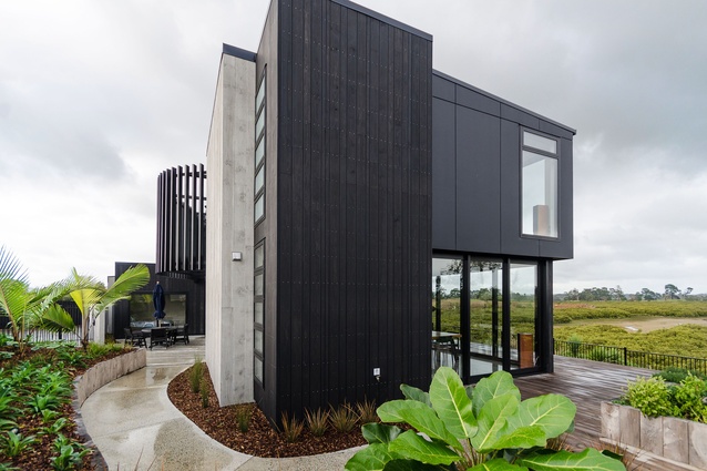 National finalist and Gold Award-winning house by David Reid Homes Counties in Papakura, Auckland. Architect: AD Architecture. Site specific and reflects the owners' interests.