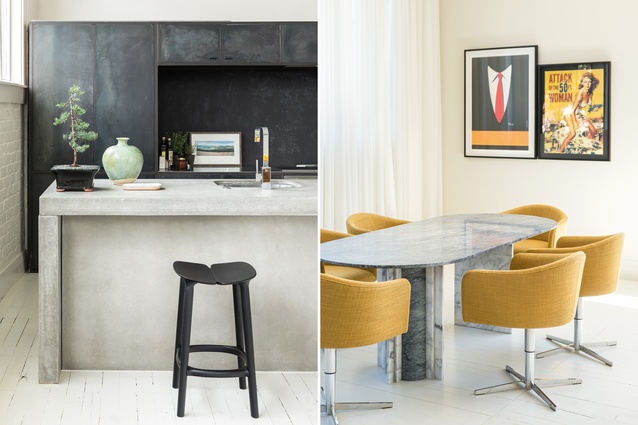 The dining area features a marble table and vintage mustard chairs. The kitchen cabinetry is blackened steel and the benches are fibreglass and concrete.