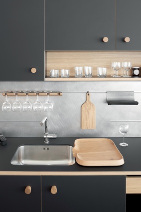 Slotted back-splash panels provide flexible storage for kitchen utensils and ingredients.
