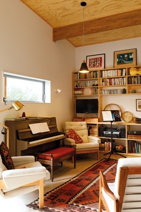 The living area doubles up as a music room for its owners who are talented musicians.
