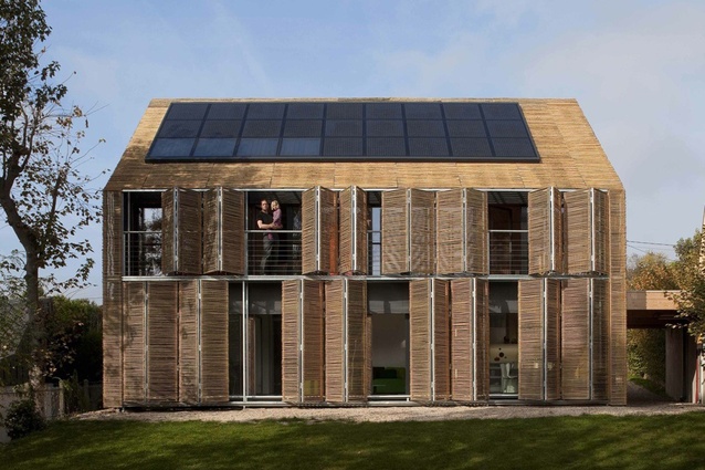 Passive House, France by Karawitz Architecture. Non-treated bamboo makes up the second skin that envelops the skeleton made of large wood panels.