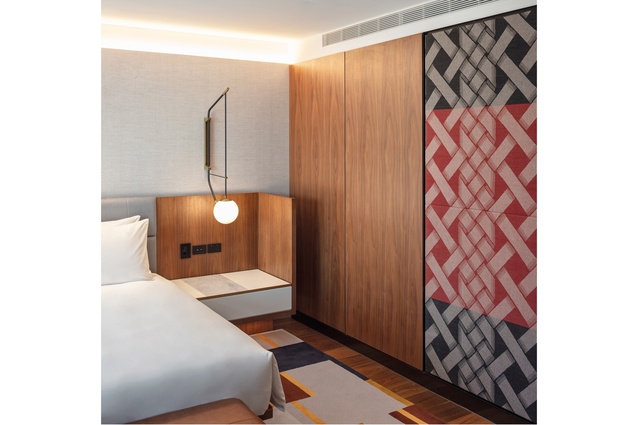 Printed fabric panels in the guest rooms were made by Maxwell Rodgers to artist Beronia Scott’s design.
