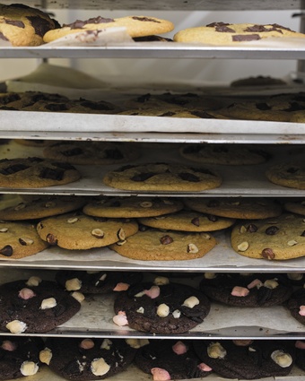 Cookies cooling on the rack. Despite the small size of the shop, baking is done on site in a well-organised kitchen.