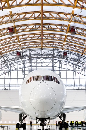 The last three trusses are steel to absorb the extra loads imposed by the system of massive doors.