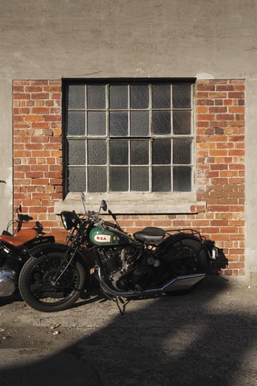Building exterior with classic BSA motorcycle.