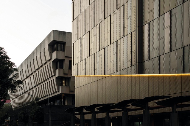 Visually, although twice the size, the new block still lines up with the bulk of Te Puna National Library.
