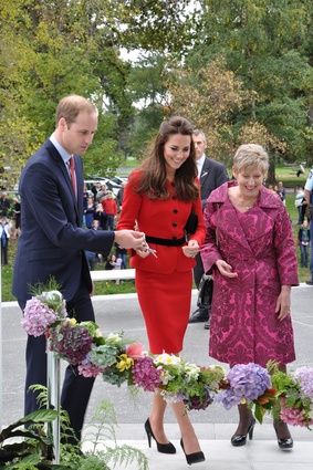 The Duke and Duchess are joined by Christchurch mayor Lianne Dalziel in cutting the floral garland.