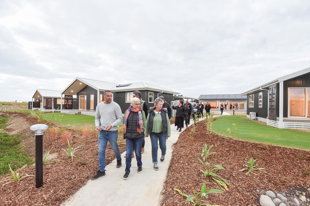 Keni-Duke Hetet, pictured leading a group through the Te Āwhina Marae papakāinga, says it has been a long-held dream to have whānau living at the marae.