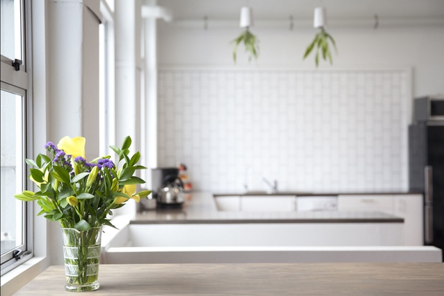 Upside-down planters and flowers add splashes of colour to the staff kitchen.