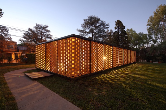 Experimental brick pavilion, Argentina. The brick panels are moveable and allow for an ever-changing filter of light while also maintaining privacy for the occupants.