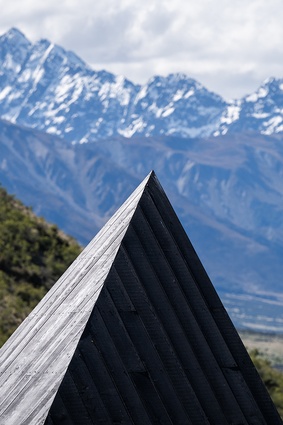 Its striking geometry subtly references the mountain ranges without overpowering its idyllic setting.