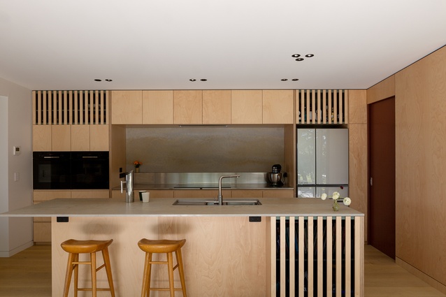 Timber cabinetry in the kitchen is a warm ply.