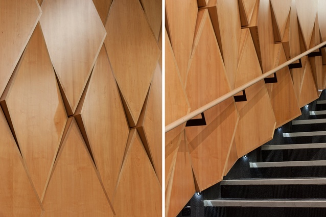 The walls and ceilings of the theatre are timber veneered panels – acoustically absorbent or reflective as required – arranged as a geometrically complex surface of diamond patterns.